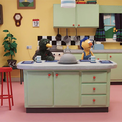 two puppets in a kitchen